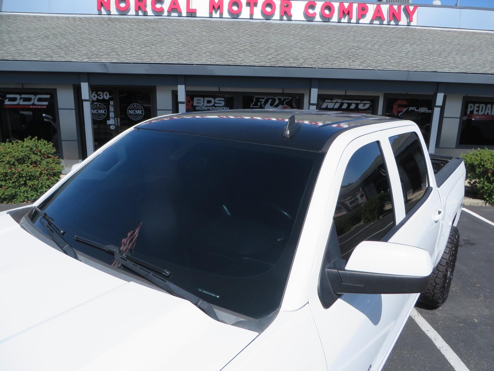 2018 White /BLACK Chevrolet Silverado 1500 LT (3GCPCREC7JG) with an 5.3L V8 OHV 16V engine, automatic transmission, located at 2630 Grass Valley Highway, Auburn, CA, 95603, (530) 508-5100, 38.937893, -121.095482 - Must see Pre Runner.... CST front lift spindals, Camburg UCA's, King Adjustable 2.5 Coil-overs, King 2.5 rear shocks, 35" Toyo RT Trail tires, 17" Method Race wheels, MZ front skid plate, G2 rear differntail cover, Full size bed mounted spare tire, Black Vinyl roof wrap, smoke tail lights and 3rd br - Photo #12